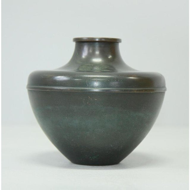 This rare and refined bronze vase by nordiska juvelaktiebolaget (nj) of sweden features the brand's signature sleek lines...