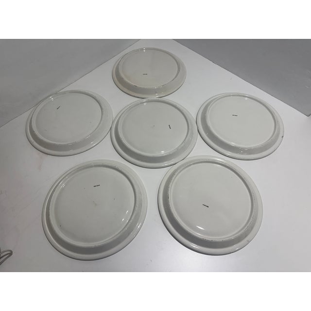 A six-piece set of Antique hand painted Stick Spatterware divided plates, each measuring 10.75 inches in diameter. Crafted...