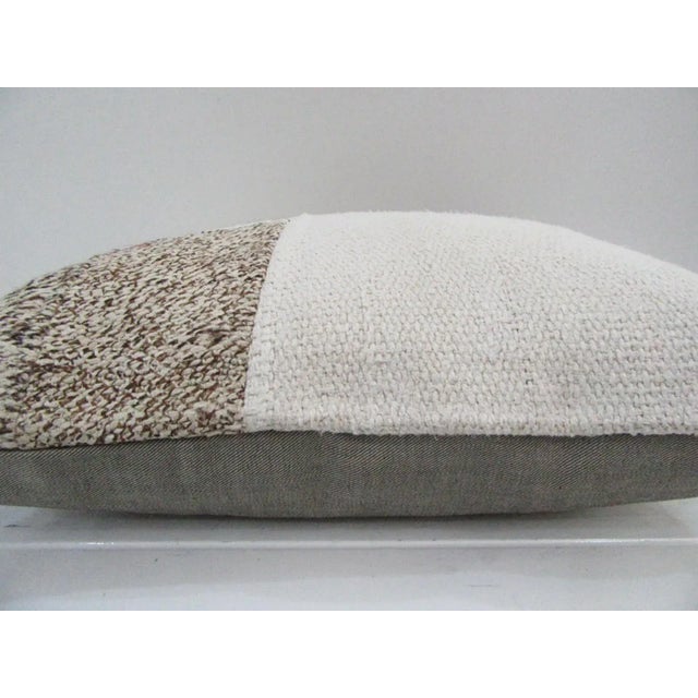 This is a pillow cover made from a vintage kilim rug. The piece was properly washed and ready to use. Pillow inserts not...