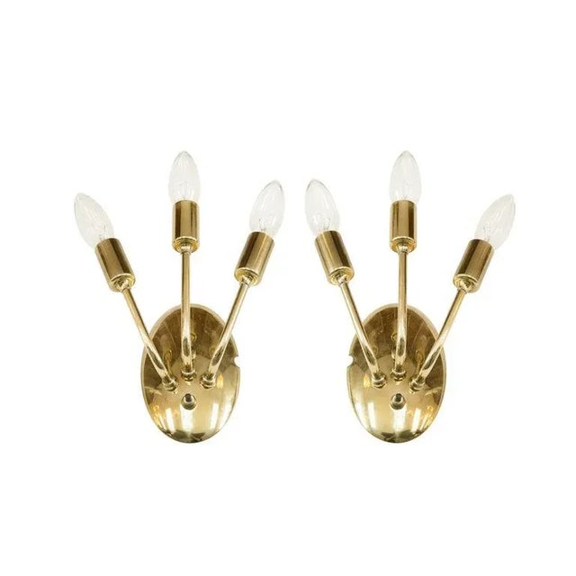 Pair of sconces original from Italy, circa 1950s. Brass has been hand polished. Fully rewired.