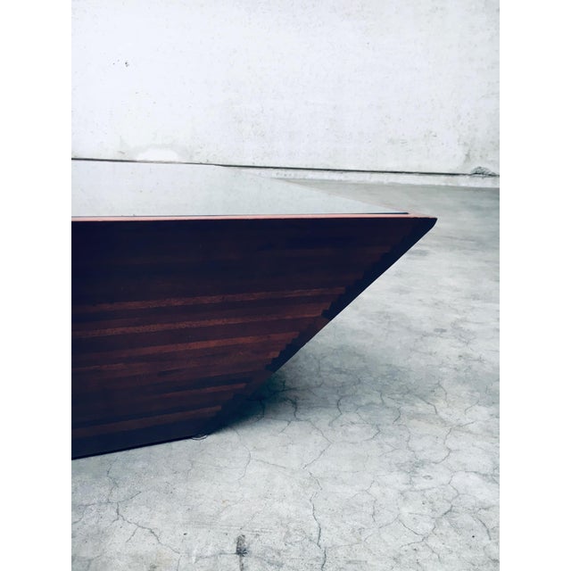 Postmodern Design 'Reverse Pyramid' Square Coffee Table. Made in the 1980's. Wood reverse pyramid shape with steps on the...