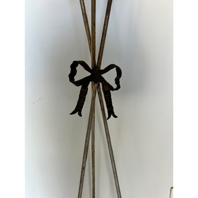 French basket form jardinieres with ribbon and arrow form base. Plant stand. Wrought iron with distressed paint. 19th...
