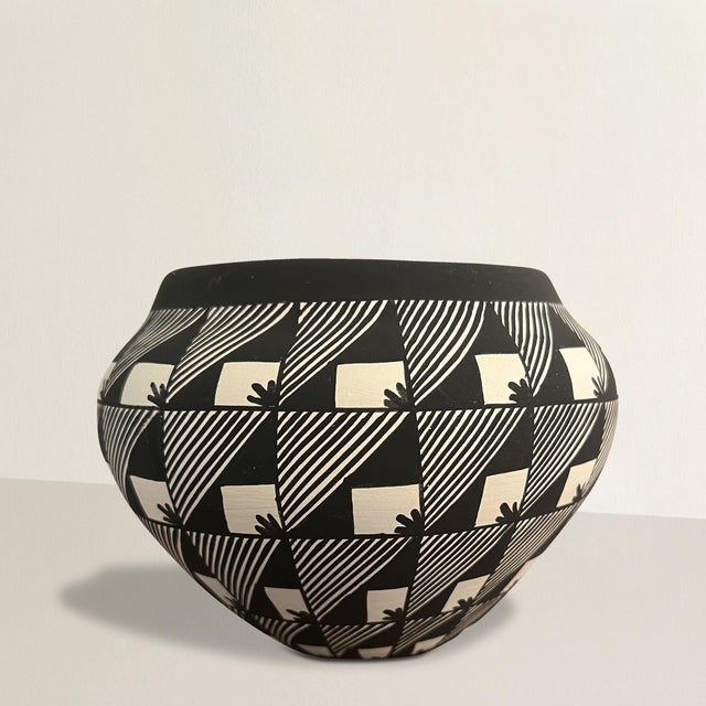 This early 21st-century Acoma Pueblo pottery bowl, crafted by renowned master potter Virginia Victorino, exemplifies the...