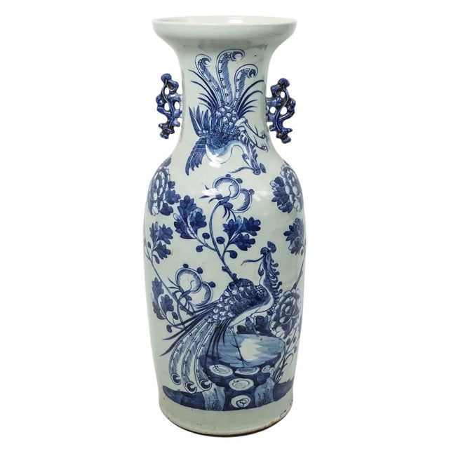 A finely balanced Chinese porcelain vase from the late Qing dynasty, decorated in underglaze cobalt blue with elegant...