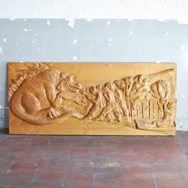Mythological Figure of a Dragon and Some Commoners Bas-Relief in Solid Wood, 1960s, in Worn conditions. Designed 1960 to 1969