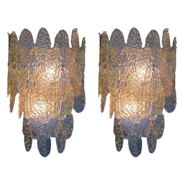 A stunning pair of 1960s glass disk sconces made in Murano, Italy. Designed by well known Italian designer Gino Vistosi...
