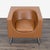 This STUA lounge chair features a unique, modern design with a rounded brown leather seat and sleek chrome legs. The chair...