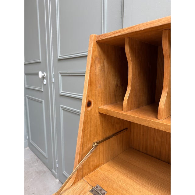 This drop-front secretary desk embodies the best of 1950s-1960s nordic design: clean lines, warm wood, and functionality...