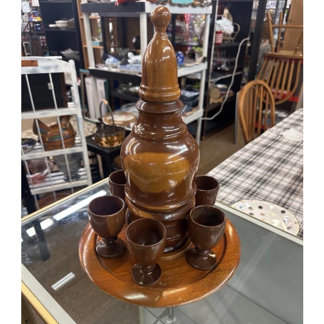 Wooden Cordial/Sake Set with 6 Cups, Tray, and Decanter Two of the cups have chips other than that everything else is an...