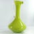 A beautiful, tall vase of hand-formed lime-colored glass. The clear handle is made of drawn glass. This is an original...