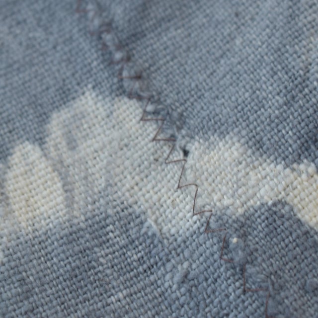 The cloth is made from Indigo resist-dyed cotton. This textile probably comes from the Dogon or Mossi people of Mali and...