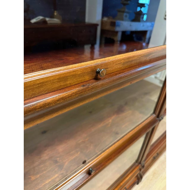 Antique mahogany Globe Wernicke bookcase in a 2 x 3-bay configuration. Beautiful weathered patina. with drawers in the...
