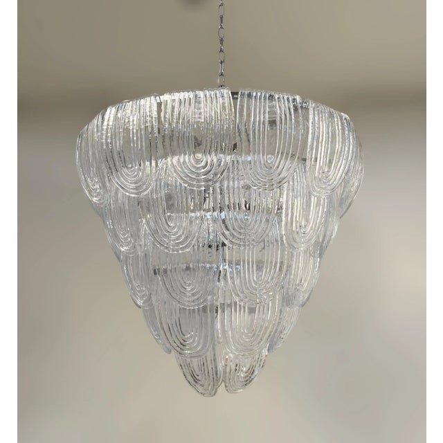 Italian chandelier with vintage 1960s clear ribbed curved Murano glasses, mounted on newly made chrome finish metal frame...