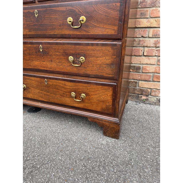 This is a lovely 18th century Georgian chest of drawers with two short and three long drawers. The chest stands on shaped...