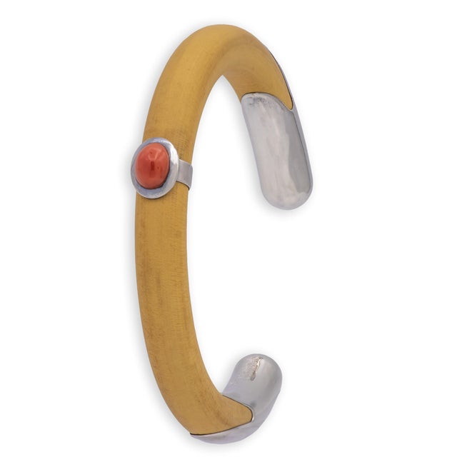 A rare and collectible early Peretti design for Tiffany & Co., this open cuff bracelet combines a warm natural rattan wood...