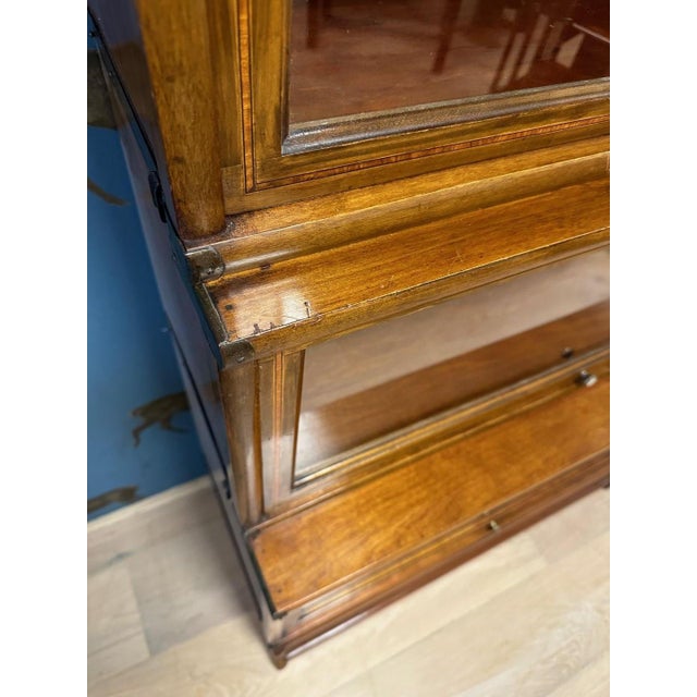 Small antique walnut Globe Wernicke bookcase. Consisting of 4 different depths. The lower part can hold books of folder...