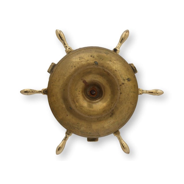 Heavy late nineteenth century English cast brass ashtray modeled as a ship's wheel with a central match holder. Originally...