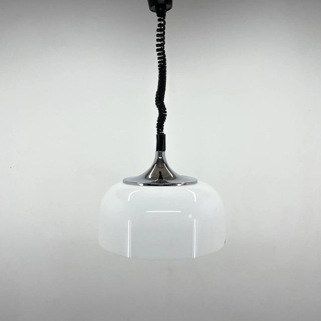 Vintage adjustable, space age pendant, designed by Guzzini for Meblo in the 1970s. Very good vintage condition. The max...