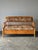 A wonderful antique Central European pine bench featuring slender spindle detailing and an ingenious multifunctional...