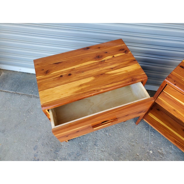 Great little pair of vintage solid wood night stands. The wood appears to be cedar and they appear to be handmade. They...