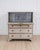 An antique Swedish bureau in antique white. This piece of furniture consists of two stacked sections. The upper section is...
