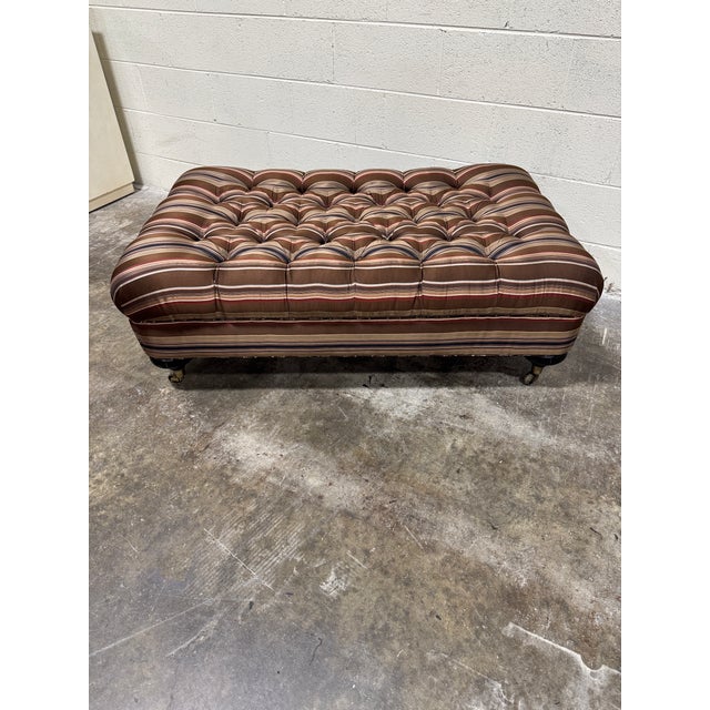 I am in love with this ottoman and its colorway! Ribboned striped silk fabric in rich brown, navy, rust and cream colors....