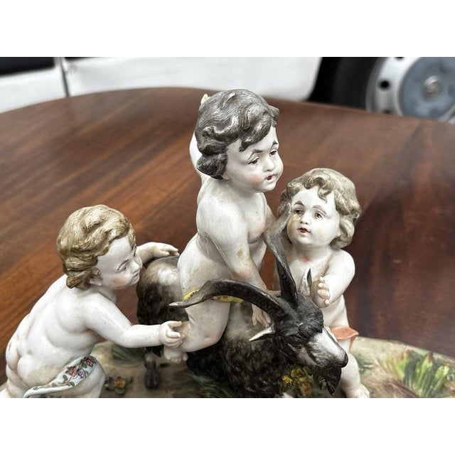 Porcelain Group of Nude Putti & the Goat Amalthea on Wooden Display Stand For Sale - Image 14 of 16
