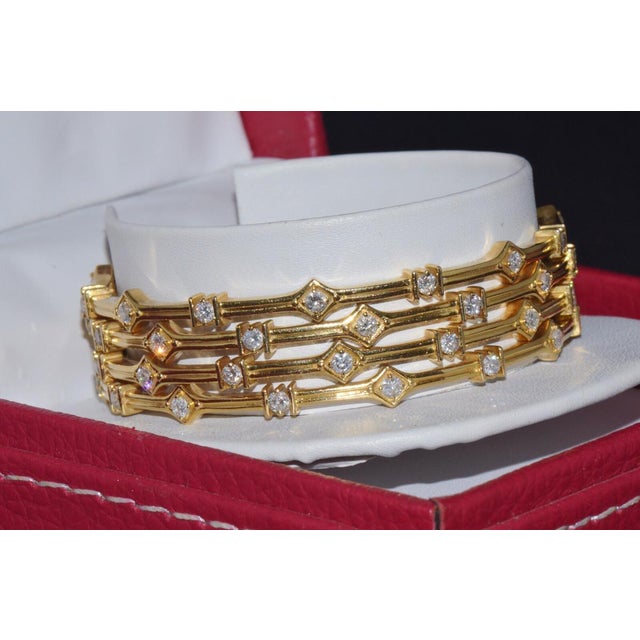 Set of 4 gorgeous 18K solid gold diamond bangle bracelets with natural diamonds. This exquisite set features four...