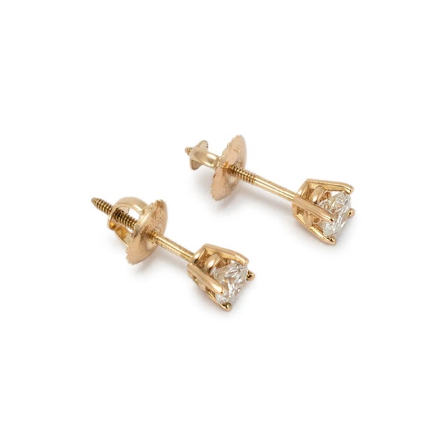 Metal Type: 14K Yellow Gold Diameter: 4.25 mm Weight: 1.03 gram One pair of 14K yellow gold diamond stud earrings with...