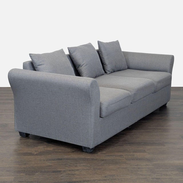 This stylish 3-seat sofa features a sleek gray fabric and three comfortable seat cushions. It comes with three matching...