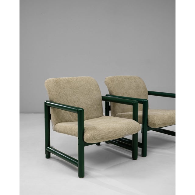This pair of 20th Century Czech lounge chairs features a distinctive blend of mid-century modern form and industrial...