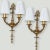 An exceptional antique pair of French bronze Louis XVI wall sconces. The antique sconces are heavy cast bronze. with off...