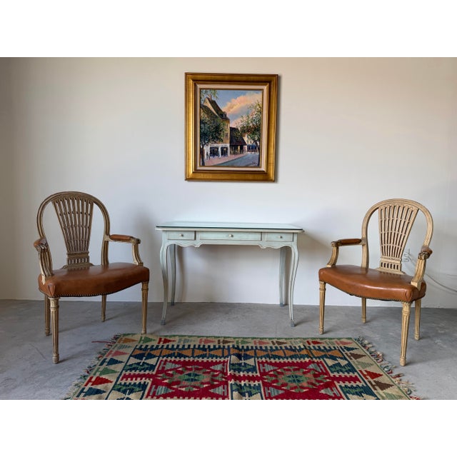 Elegant vintage Italian writing desk crafted in the French Provincial Louis XV style. This charming piece features...