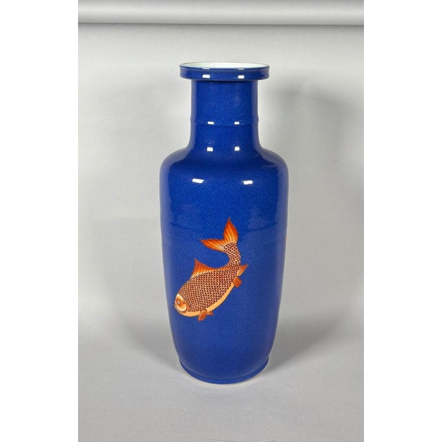 CHINA, 19th century. Porcelain vase with a scroll decorated with carp on a powder blue background. For Sale