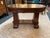 Design Plus Gallery presents a Tiger Oak Wood Library Table in the American Empire Style. Likely dating back to the 1920's...