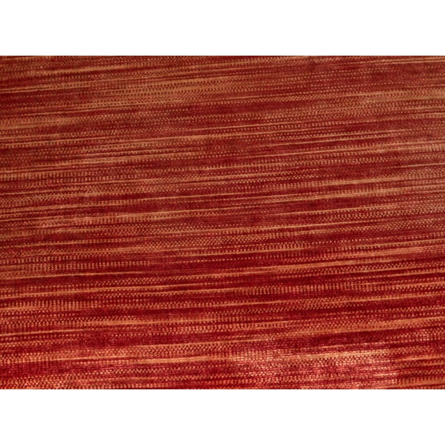 An Italian walnut bench from the early 19th century, with red fabric, petite tassels, turned legs and stretchers. Created...