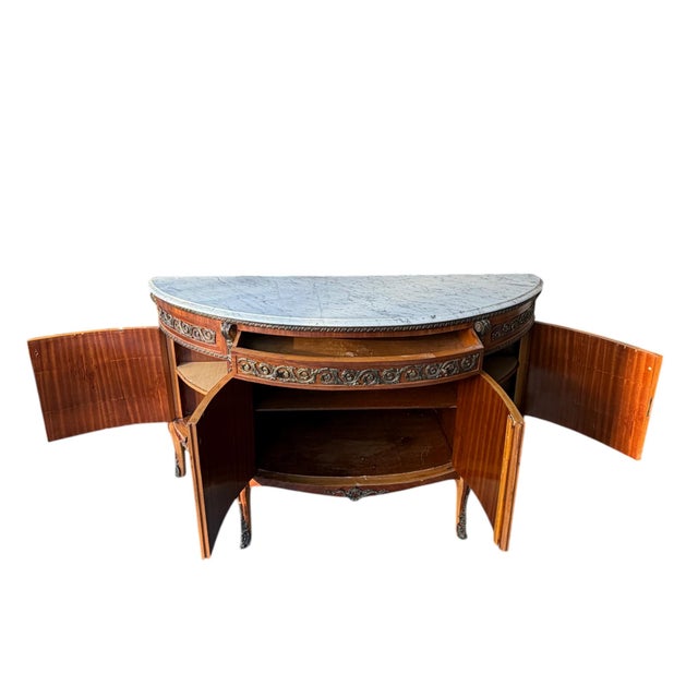 Late 19th century Louis XV Revival sideboard with shaped marble top, parquetry inlaid panels, and applied ormolu mounts....