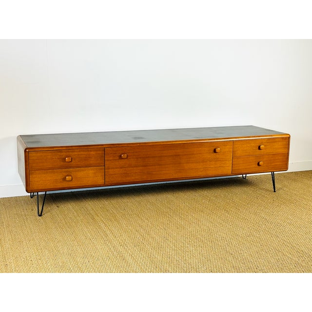 An elegant, low vintage sideboard from the 1960s with a clean, scandinavian design, perfect as a tv stand or living room...