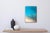 This artwork presents a serene view of a white sand beach, captured through layered resin on a wood panel. The smooth,...