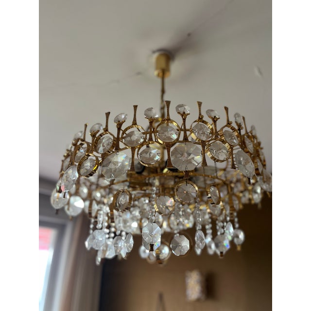 Magnificent golden chandelier or pendant light from Palwa, Germany, 1970s. It features a 24k gold plated brass frame,...