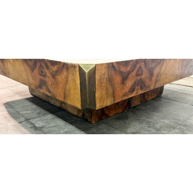Striking Italian coffee table designed by Willy Rizzo, featuring richly figured burl wood with a glossy finish. The...