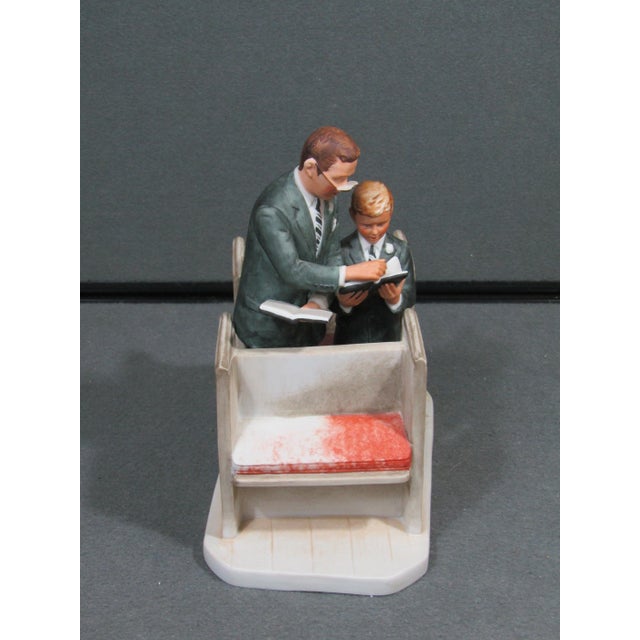 A finely detailed vintage porcelain figurine from Gorham’s Norman Rockwell Dad’s Boy Four Seasons Collection, depicting...