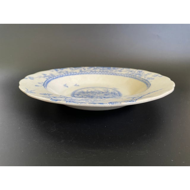 An antique Brownfield & Sons "Woodland" large rim soup bowl, featuring a transferware medallion of a farm scene with birds...