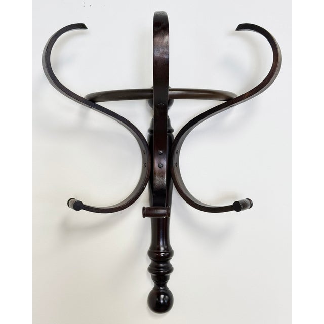 Vintage bentwood Thonet style wood coat and hat rack wall hook. Features six hooks in total, three upper and three lower....
