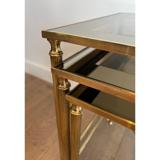 Metal 1940s Neoclassical style brass nesting tables. French work by Maison Jansen. For Sale - Image 7 of 12