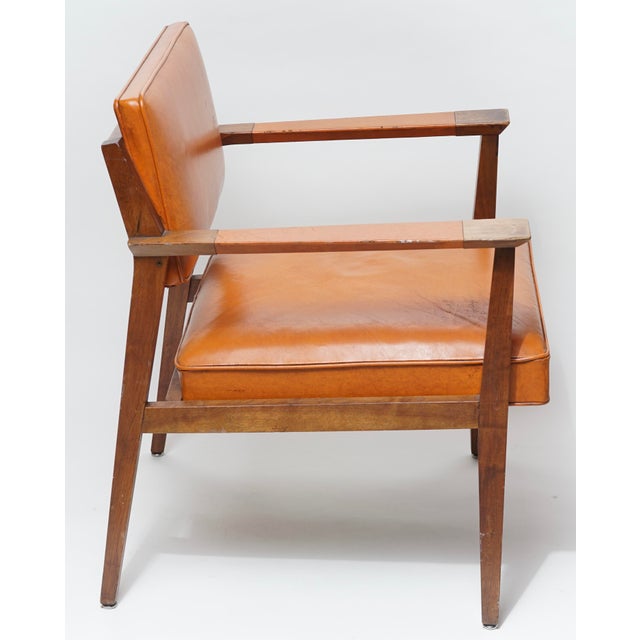 This rare walnut and leather lounge chair was made in Grand Rapids in the 50’s and designed by Giacomo Buzzitta for Stow...