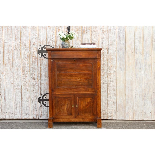 This antique mahogany secretary was found in Paris. It has an elegant appeal with a slim design. This antique french...