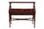 An English Chinese-Chippendale style bookcase in mahogany, circa 1970. On top a single flat shelf is finished with a pie-...