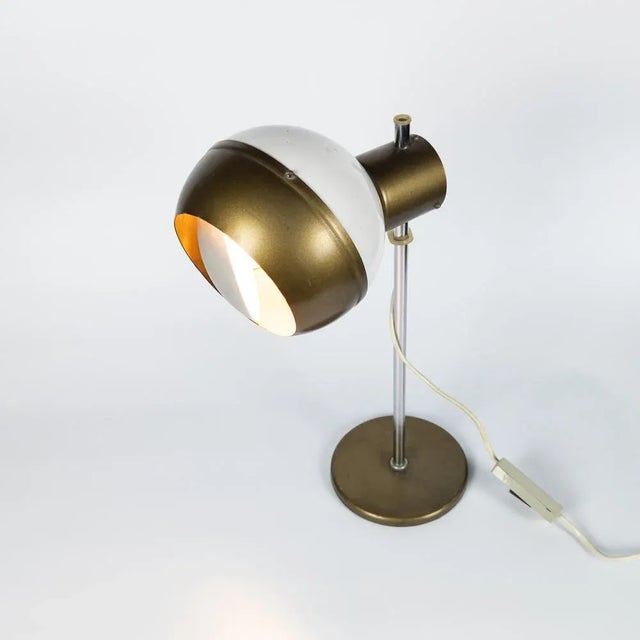 Adjustable space age lamp manufactured by Drukov, former Czechoslovakia in 1970's. Made of white and gold lacquered metal....
