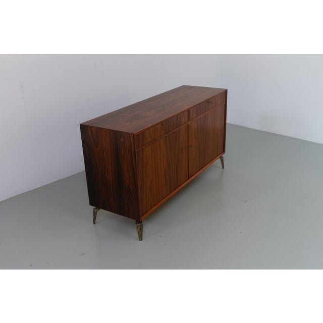 Danish Mid-Century Rosewood Sideboard, 1960s. Stunning Scandinavian Modern rosewood/palisander cabinet with vivid grain...